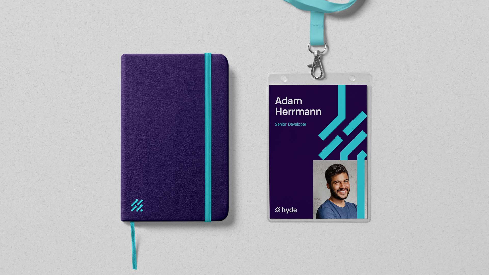 Hyde branded stationery. A5 notebook using Hyde colour palette and lanyard design for in-person events.