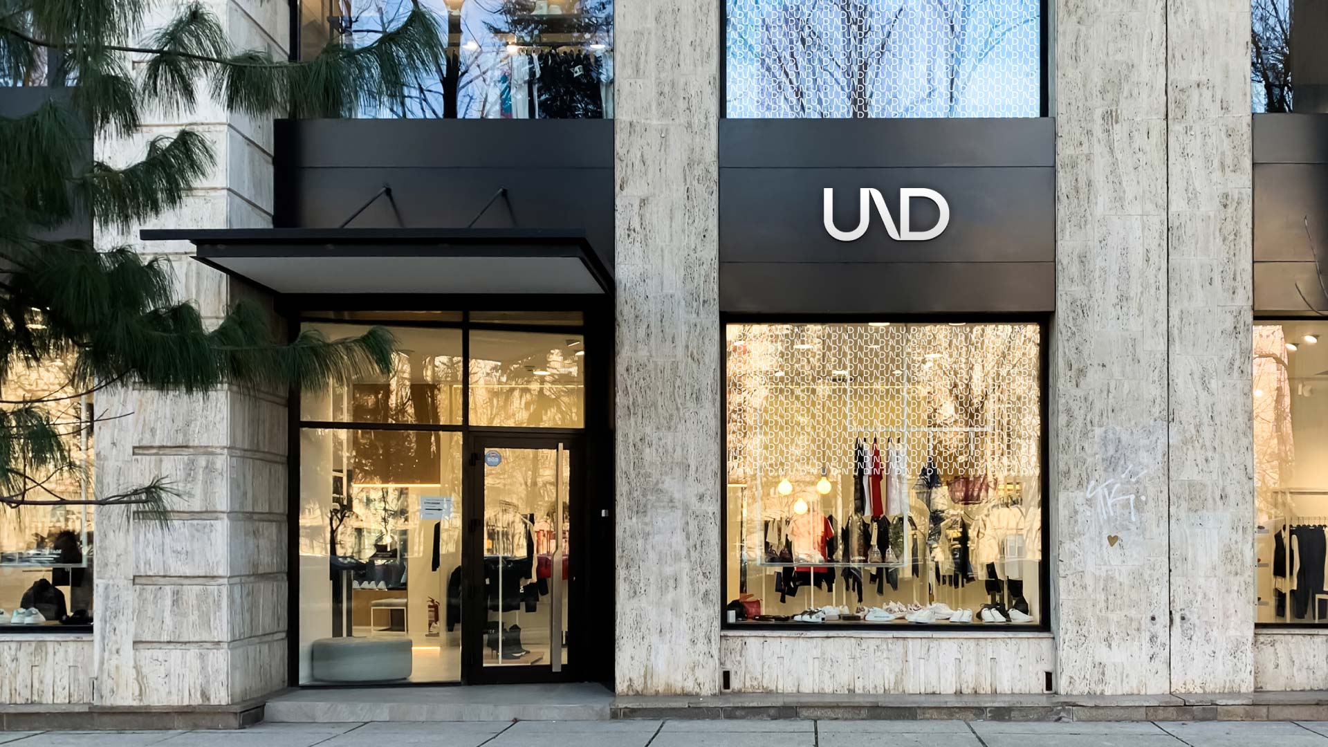 UND branded storefront, using the logo design on the signage and brand pattern on the windows.