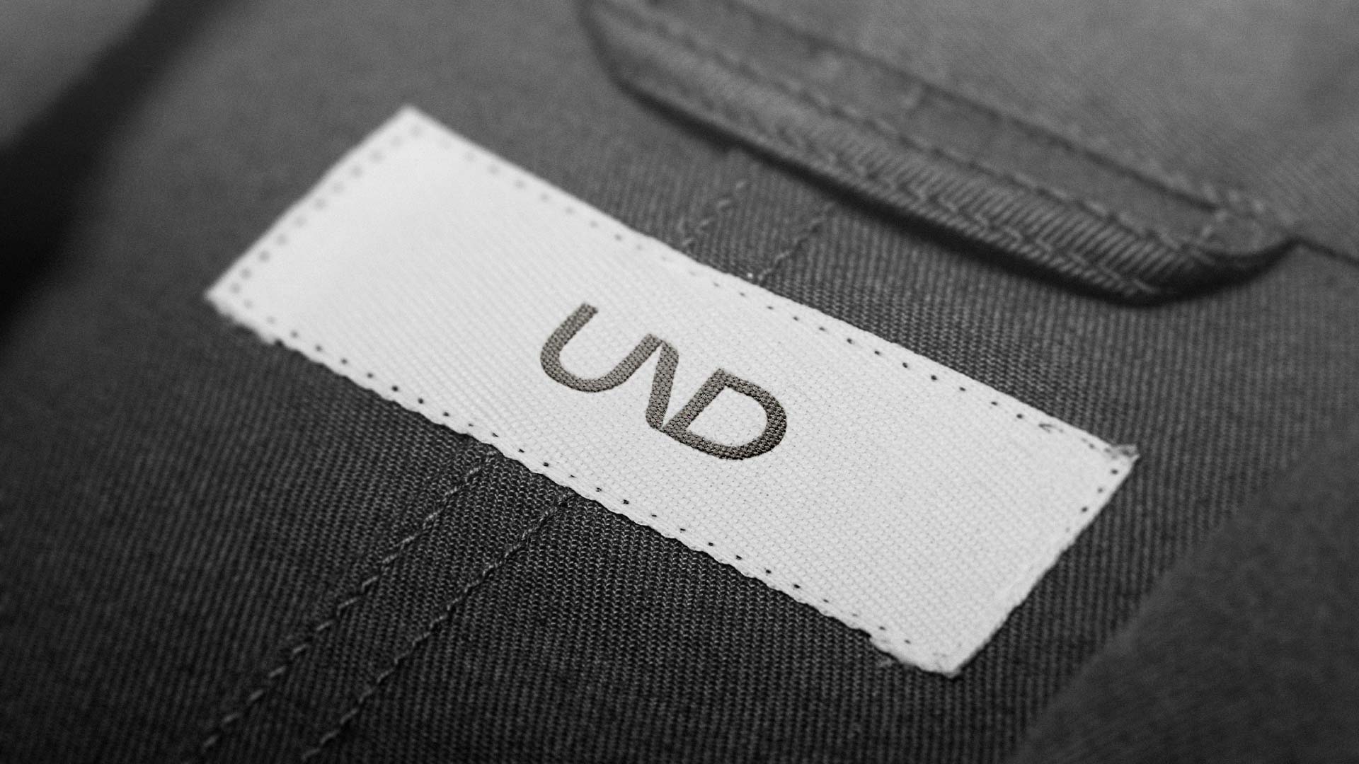 Branded clothing label for UND using the logo design.